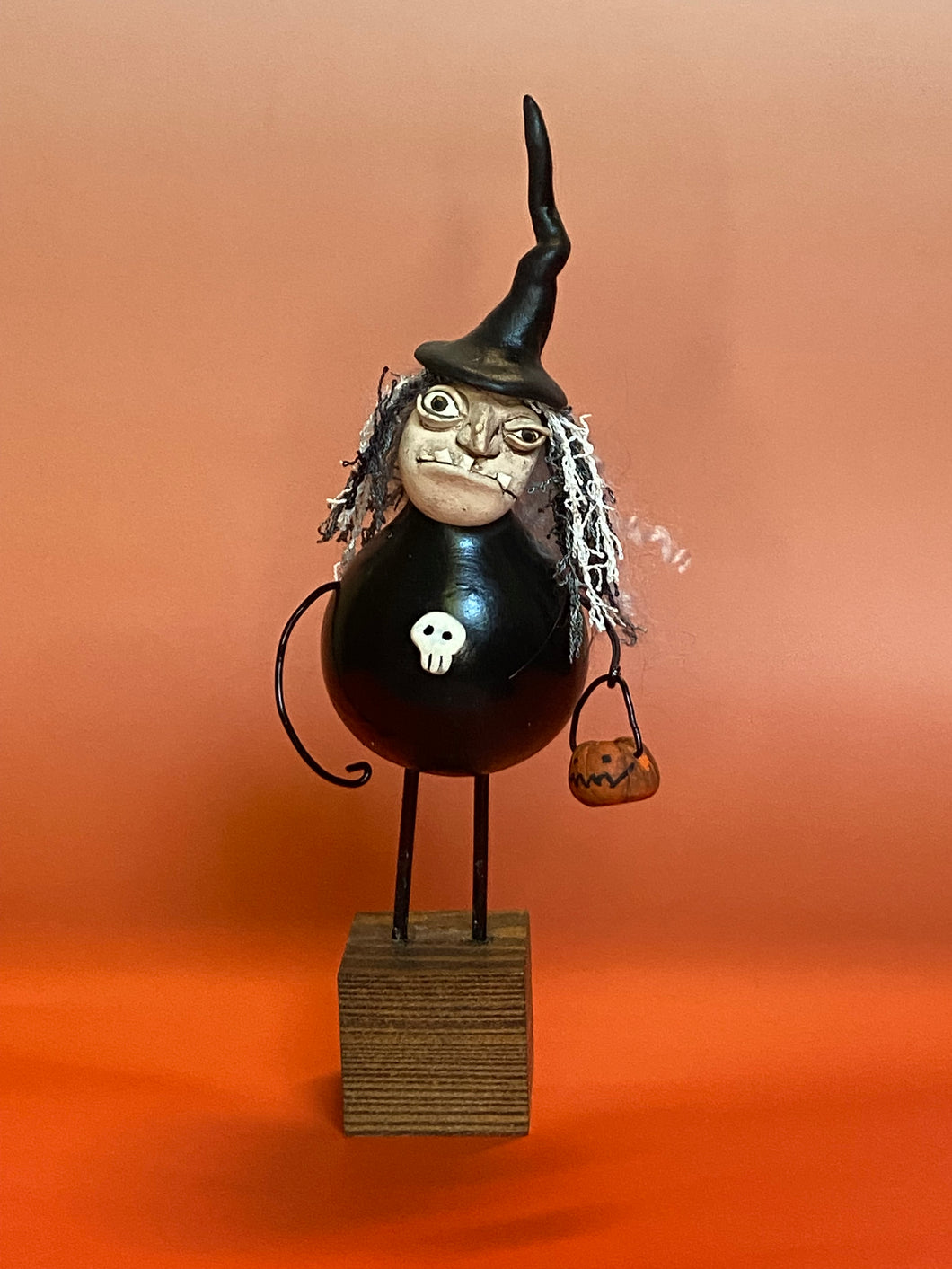 A Witch with Pumpkin Bucket